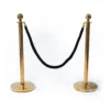Golden poles & black rope